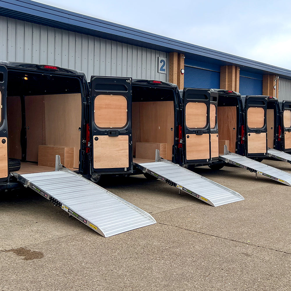 Photo of a set of 4 fixed folding van ramps fitted for a fleet of vans.